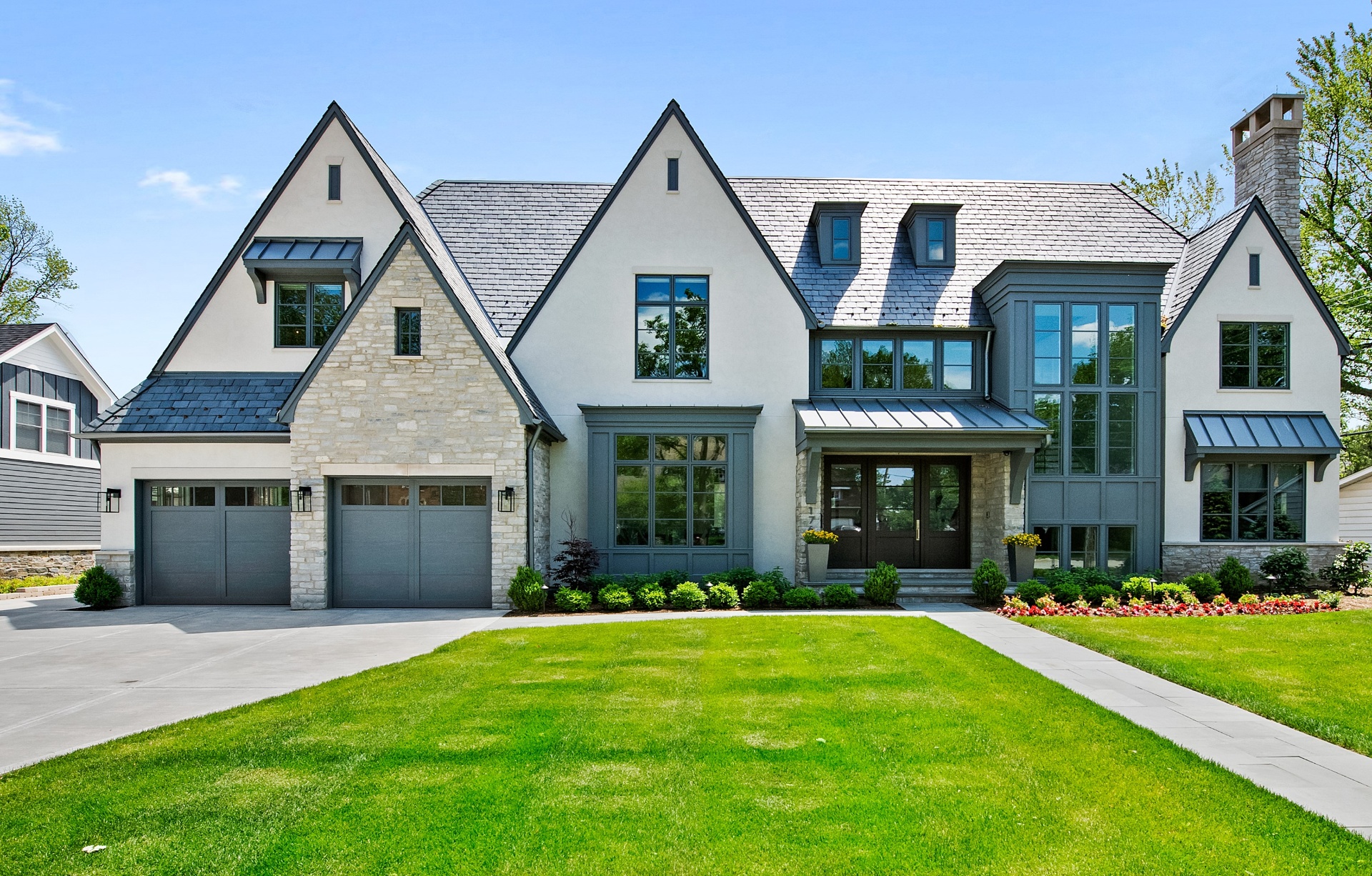 Stately custom-built home in Edmonton with stone, stucco and slate roof